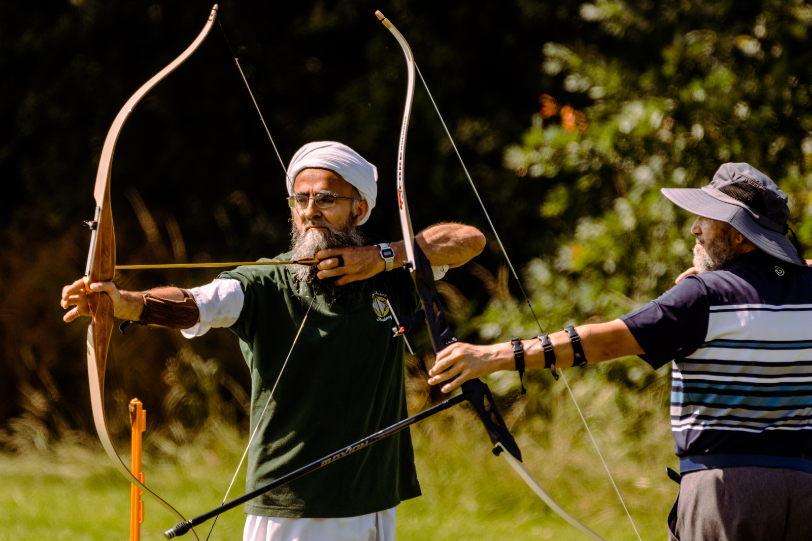 Members of the Muslim Sports Foundation try archery at Archery GB's headquarters at Lilleshall